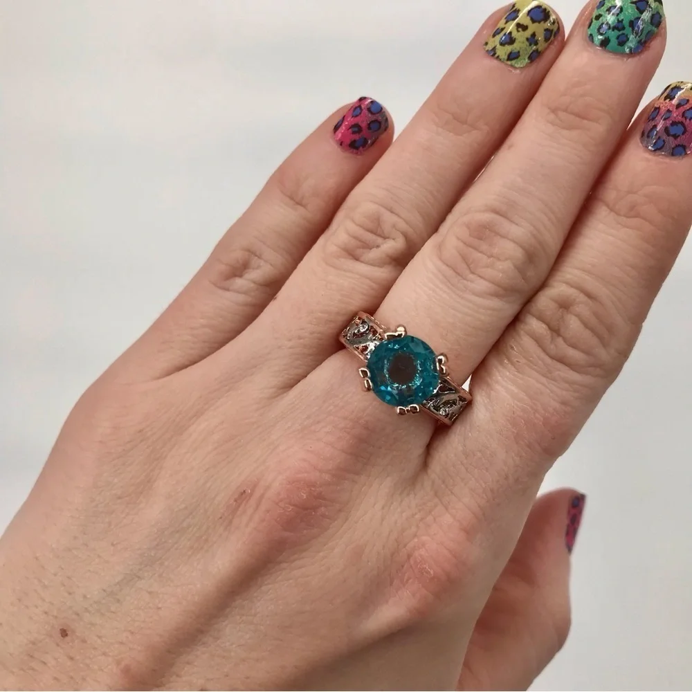 Mixed Metal Solitaire Ring with Blue Stone